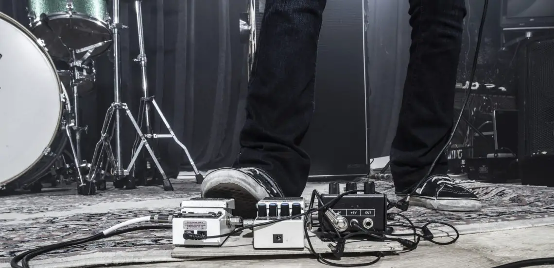 Guitarist using a footpedal