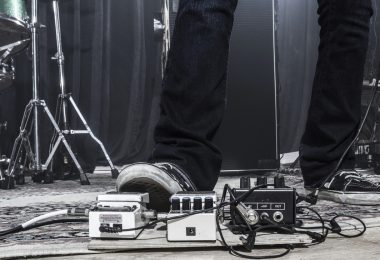 Guitarist using a footpedal