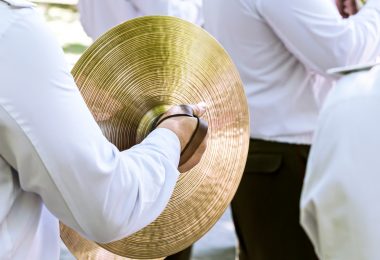 Musician plays cymbal at the festival of brass bands